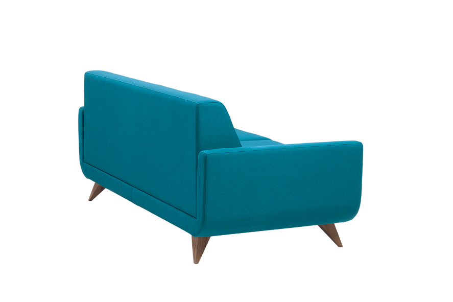 Borg's teal accent sofa on a dark studio backdrop